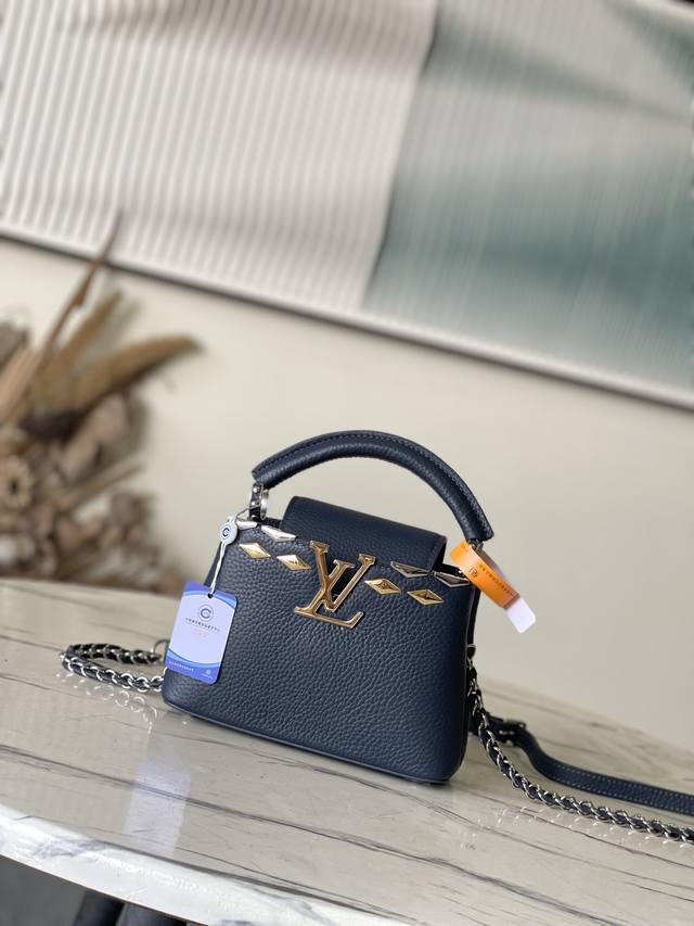 Premium Genuine Leather M12751 Royal Blue Mini Capucines Mini Handbag is crafte