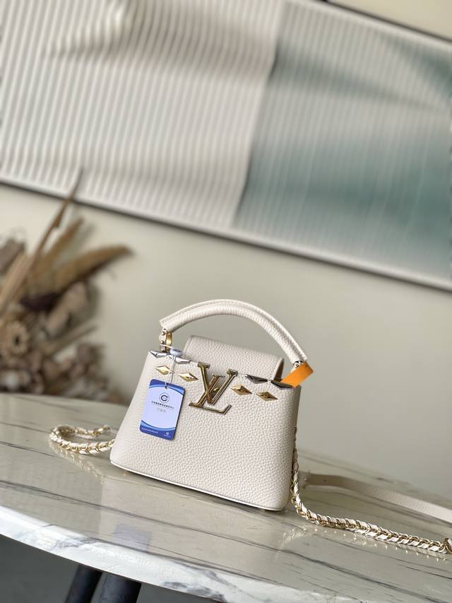 Premium Genuine Leather M11964 Off-White Mini Capucines Handbag is crafted from