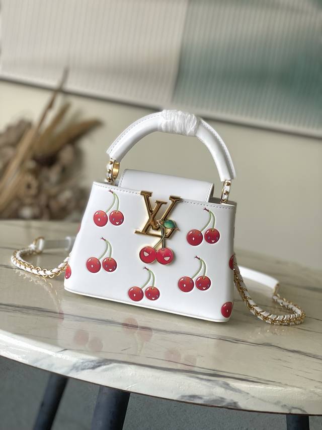 Premium Genuine Leather M13251 Mini Capucines Bag embodies the trendy spirit of
