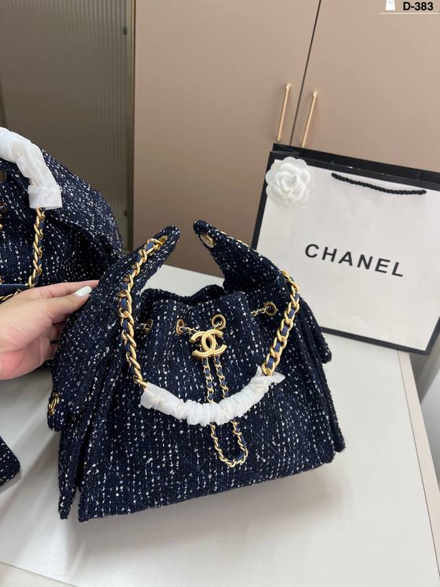 Small Chanel Chanel 25A woolen sequin drawstring bucket hobo bag black tweed mov