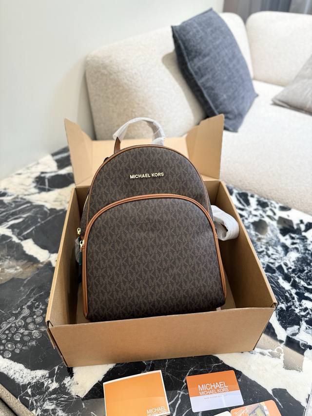 Mk Backpack The latest Abbey series backpack with small print and monogram, spac