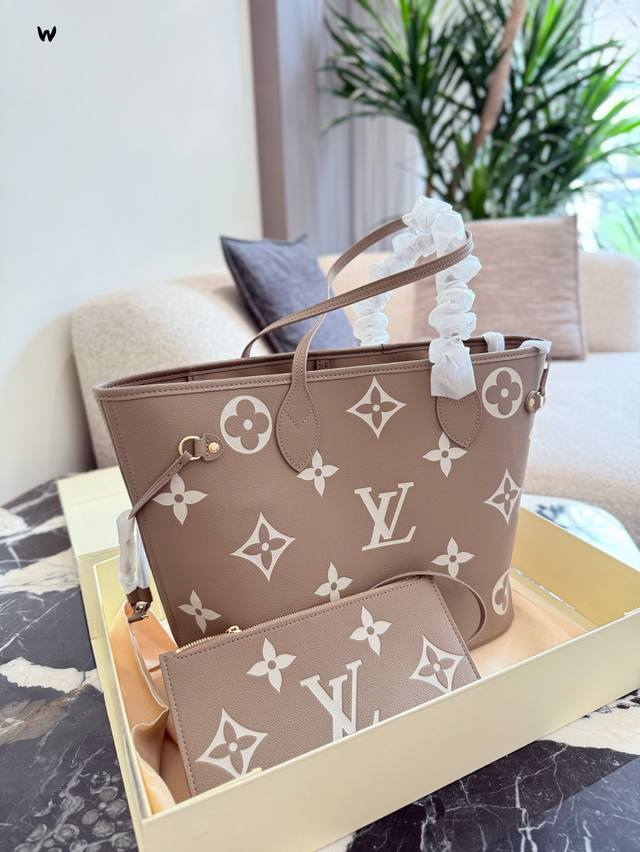 Lv shopping bag in elephant gray DDD. This versatile tote bag can be sweet or sa