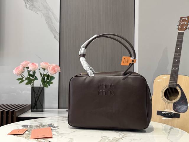 Unboxed Size: 35*22cm The Miumiu bowling briefcase is made of smooth, soft calfs