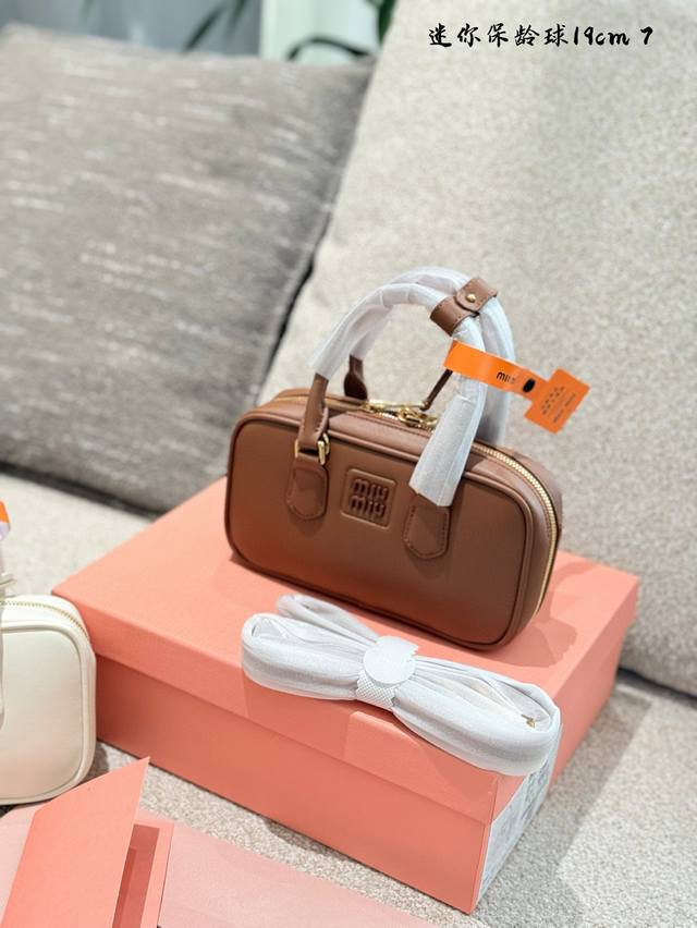 Mini The Miumiu brand has successfully transformed its style from a traditional