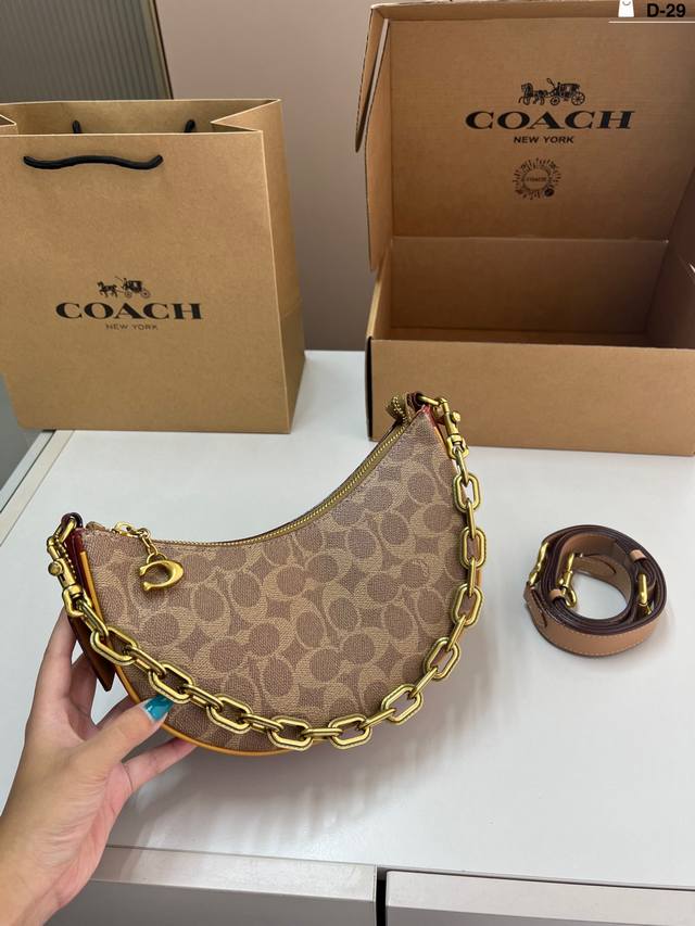 Coach's new Crescent Moon Bag Mira is a stunning bag with a small body and large