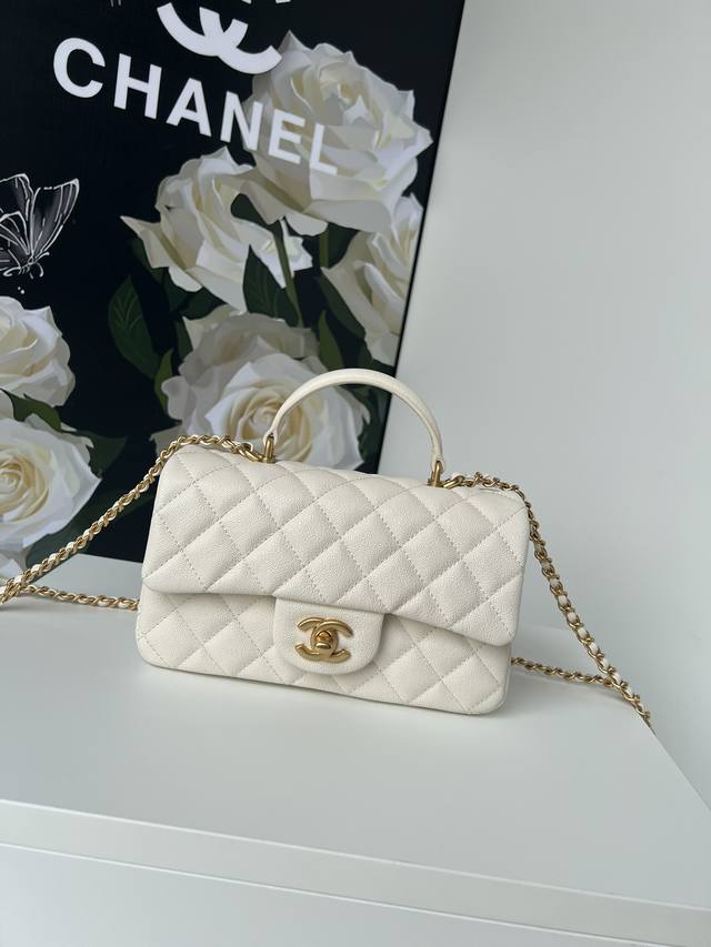 Chanel 21K's latest Mini Cf Handle Handbag As2431. The classic diamond-shaped fl
