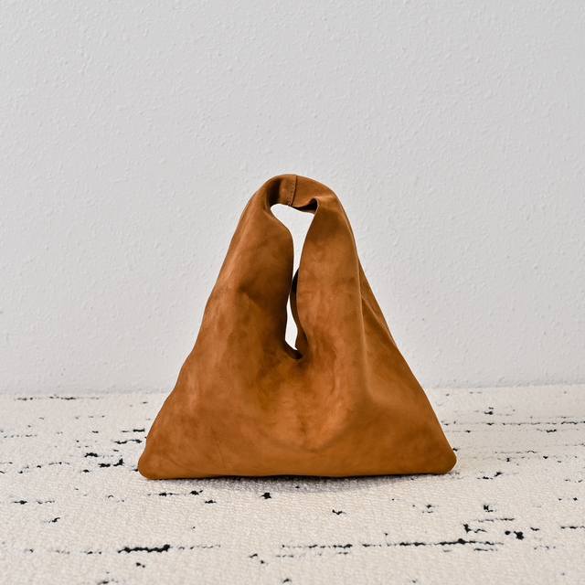 The Row Bindle Bag Mini With its minimalist and elegant design, this bag continu