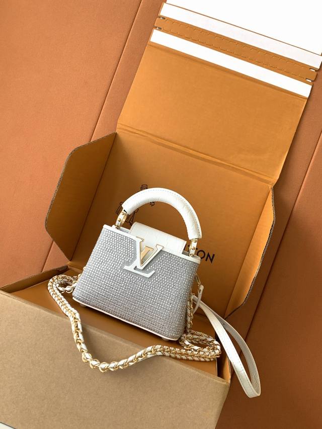 Premium all-steel hardware, featuring imported leather and hand-set crystal dia