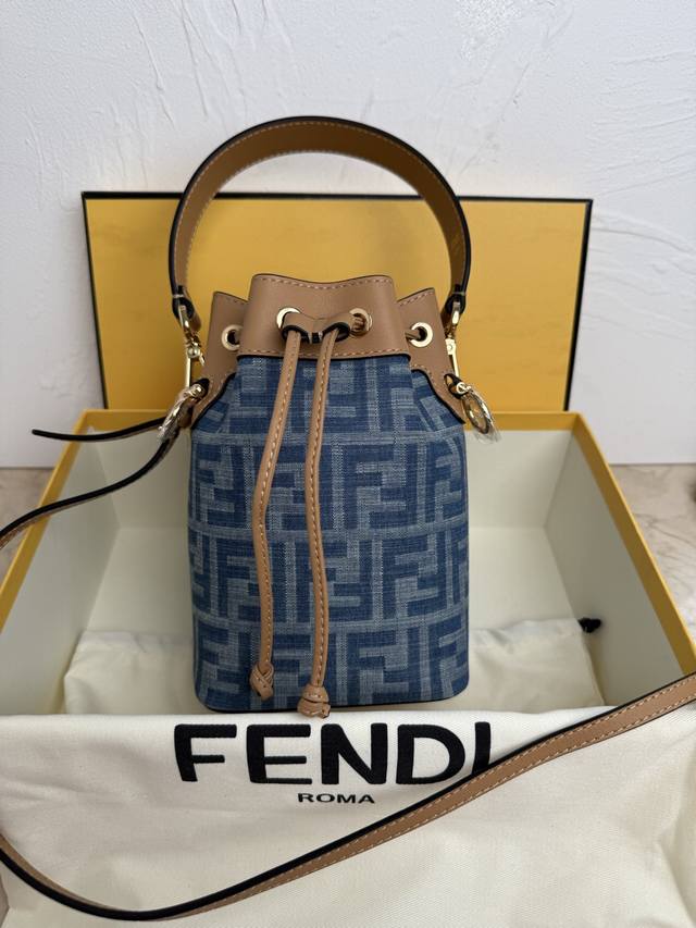 Authentic blue cloth. Paired with apricot Mon Tresor light blue leather mini bag