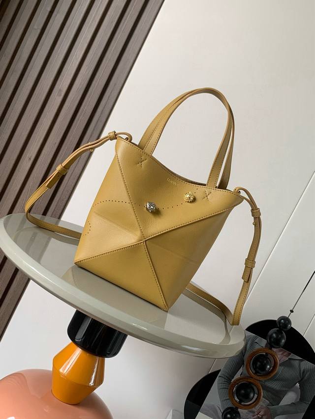 Original leather Mini shiny cowhide Puzzlefold handbag. The new Puzzle Fold hand