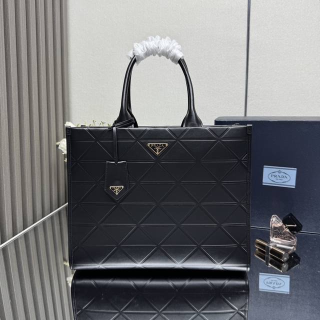 A new, premium, original, medium-sized 35cm triangular quilted tote bag with a