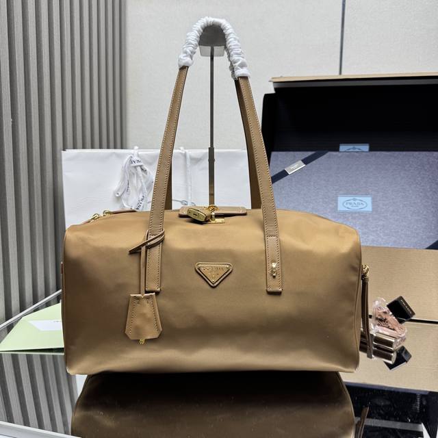 A new, premium large handbag, 1Bb135, has arrived. This recycled nylon bag, wit