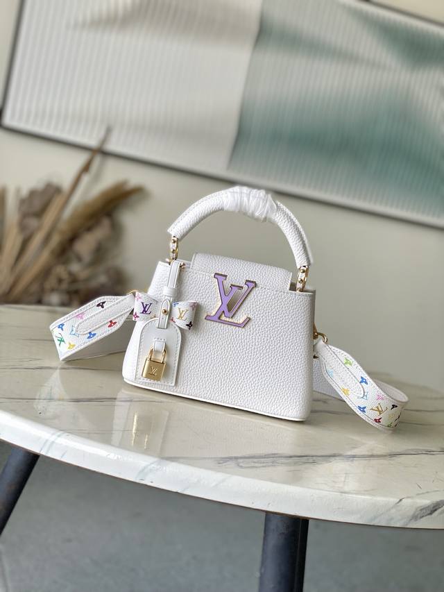 Premium Original Leather M13253 Mini. This Capucines bag, part of the Louis Vui
