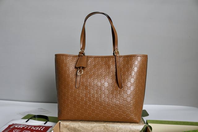 Price in quantity Description: Gg Emblem Large Tote. This tote features the bra