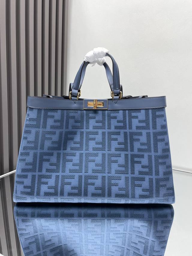 Blue Peekaboo X-Tote Classic monogram canvas with Peekaboo's classic swivel buc