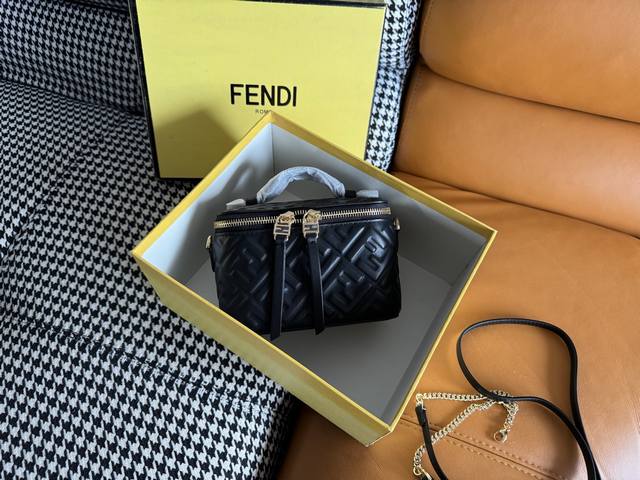 The compact Fendi Vanity bag with an upright silhouette features a double slidin