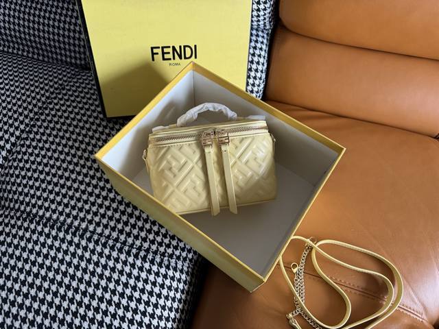 The compact Fendi Vanity bag, with its upright silhouette, features a double sli