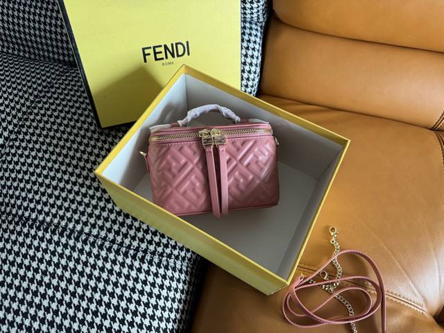 The compact Fendi Vanity bag with an upright silhouette features a double slidin
