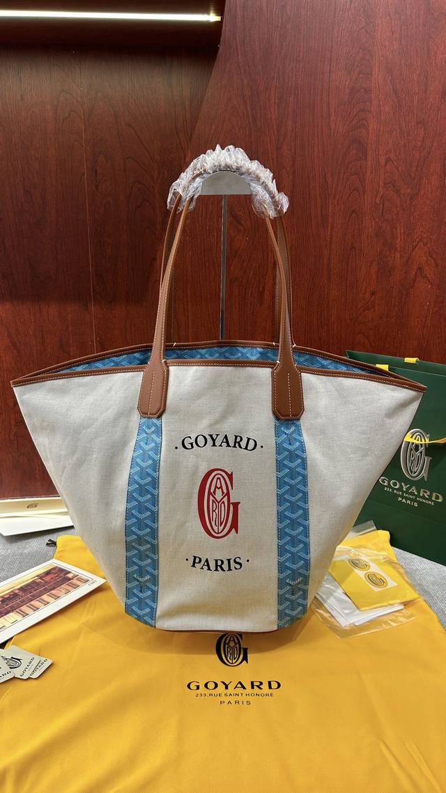 The best-selling Goyard Tote double-sided canvas beach bag in turquoise green is