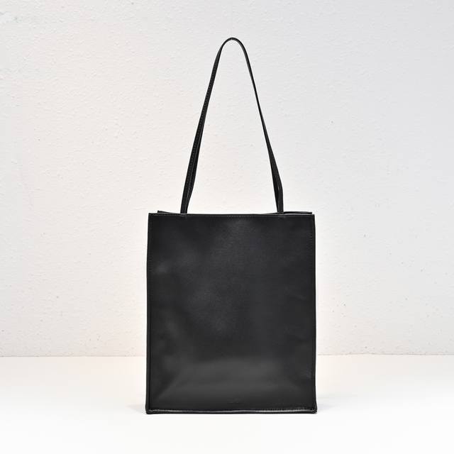Row 's exclusive romantic lambskin tote has arrived. The thin leather strap adds