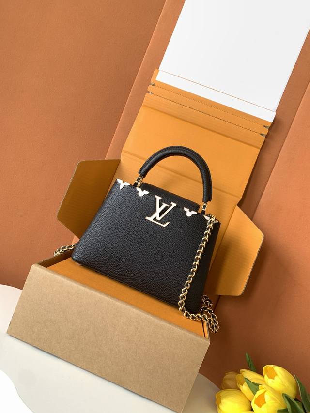 Extra-grade steel M10168 black and gold. This Capucines Nano handbag, from the