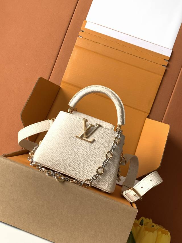 Extra-grade steel M12938 pearl white gold. This Capucines mini handbag, part of