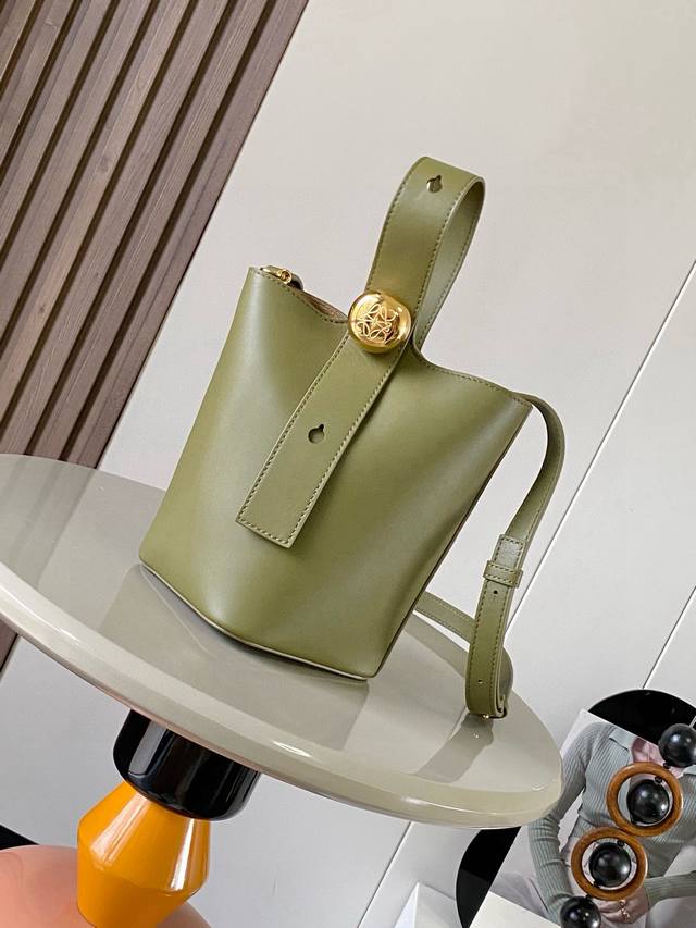 Original leather Mini soft grained cowhide leather pebble bucket bag. The pebble