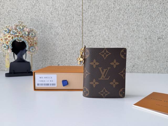 Authentic Premium Original M14613 Blue "Pocket Wallet Lv Charm" is a compact acc