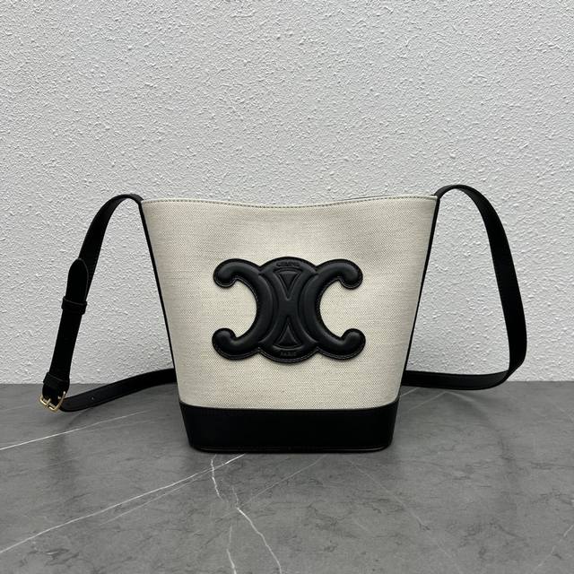 Authentic Celine's new spring/summer Cuir bucket bag features a large, 3D Arc de