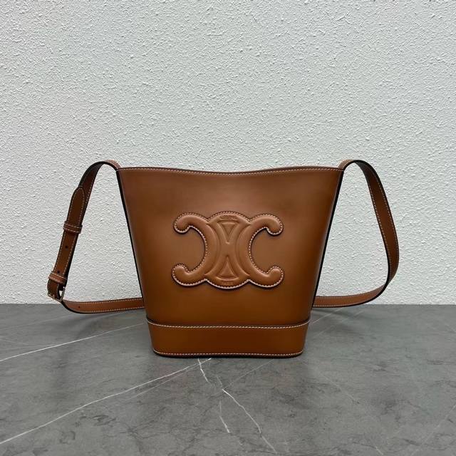 Authentic Celine's new spring/summer Cuir bucket bag features a large, 3D Arc de
