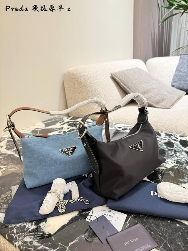 A unique and practical Prada nylon dumpling bag. This one is very cute. It looks
