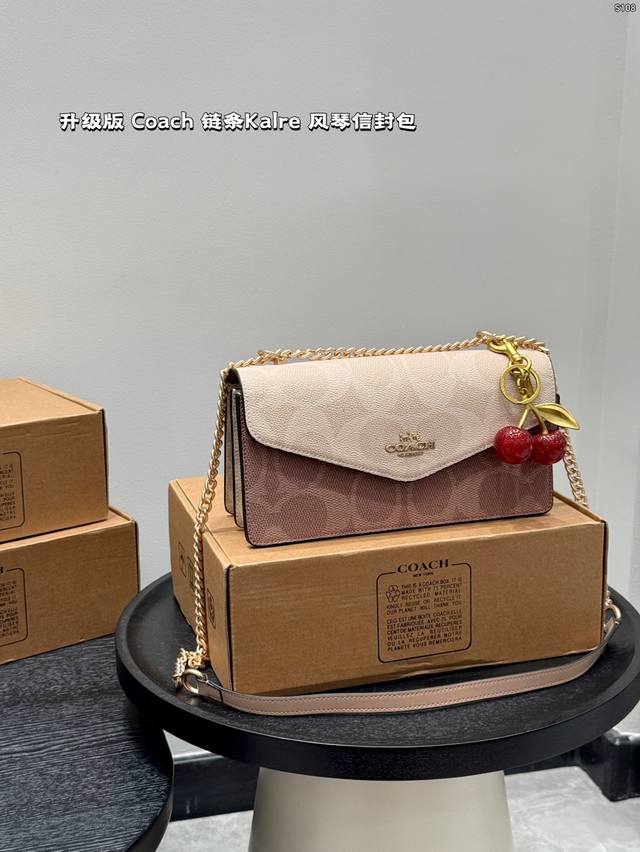 with box with cherry pendant Coach