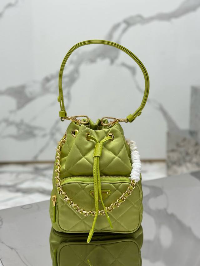 Authentic Diamond-Quartz Bucket Bag. This versatile Re-Nylon shoulder bag featur