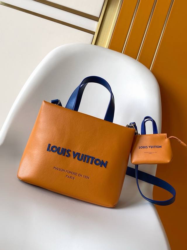 M03136 M02699 . M15237 Accessories: The Lv Mini Shopper bag charm captures the s