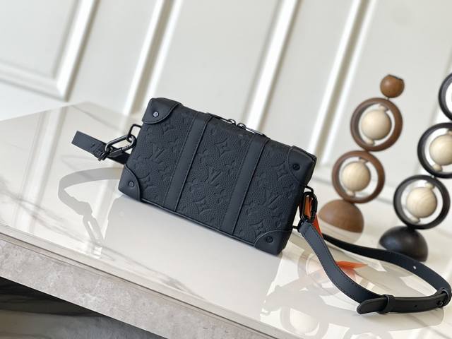 Exclusive photos of the chip-swappable Trunk Wallet. This M80224 black embossed