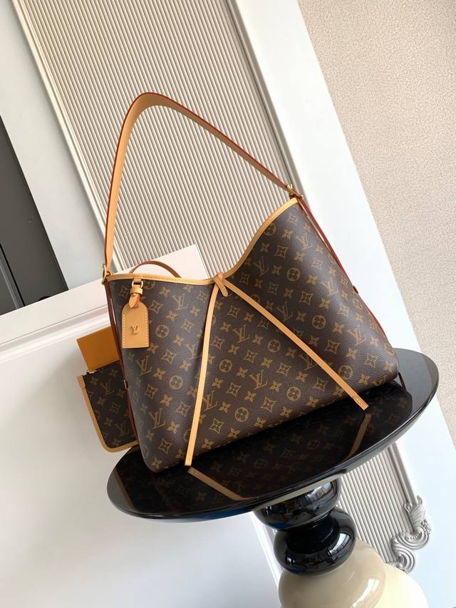 Special Edition: This small Carryall bag, crafted from Monogram canvas and trimm