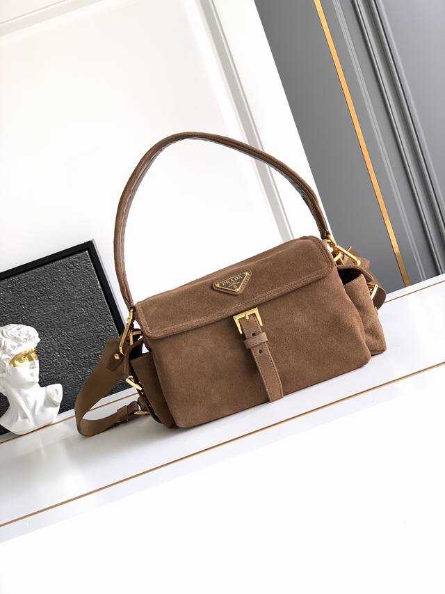 New Messenger Bag in Nubuck Leather This handbag perfectly blends sophisticatio