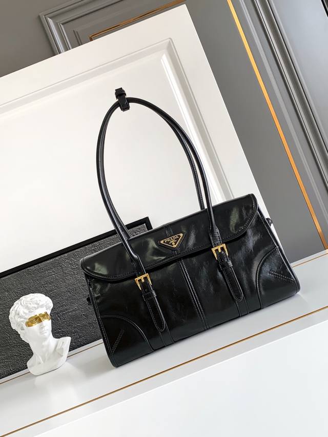 New waxed leather underarm bag, this double-buckle Soft Lux leather handbag fea