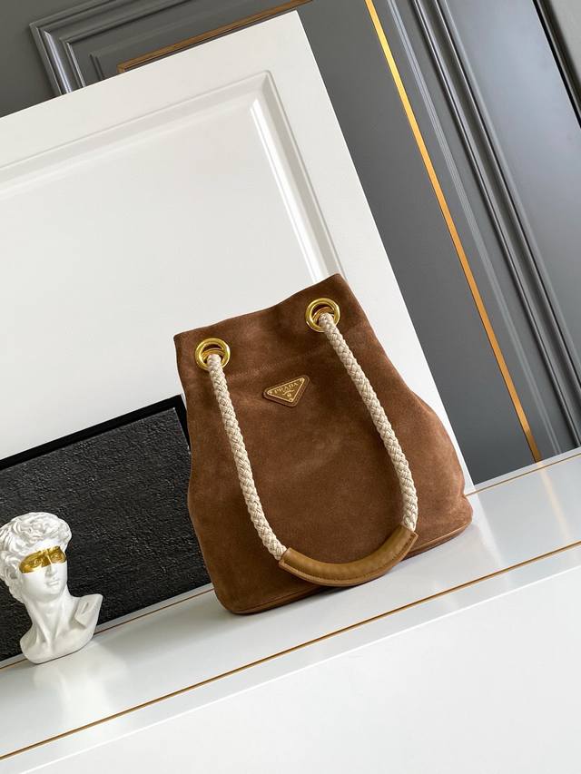 New Bucket Bag in Nubuck LeatherThis Re-Nylon handbag is designed with imported