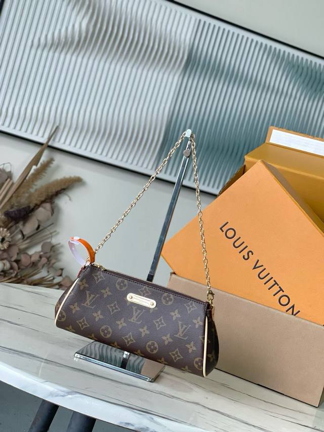 Premium original M13567 monogram. This Pochette Eva handbag features the brand'