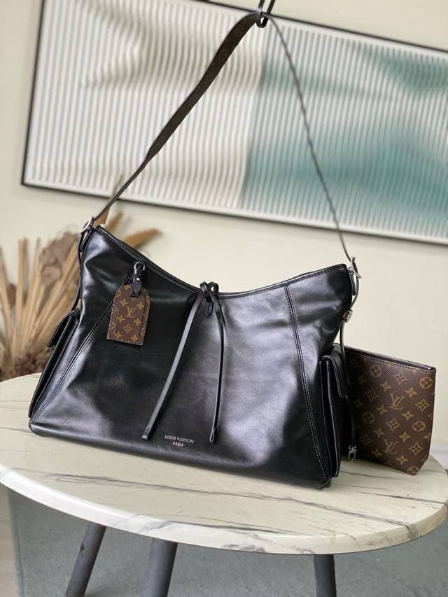 Top-grain leather, original M15175. This Carry All Travelbag is crafted from so