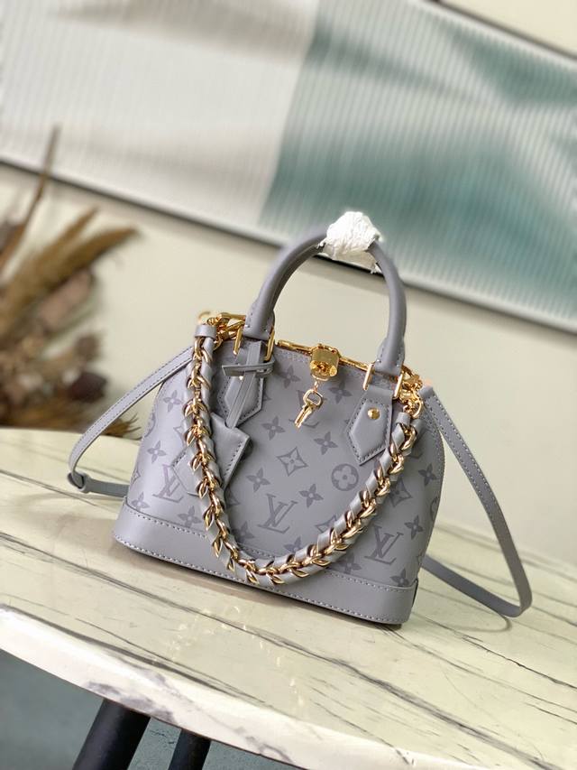 The Monogram Ink collection introduces the Alma Bb handbag, featuring cowhide l