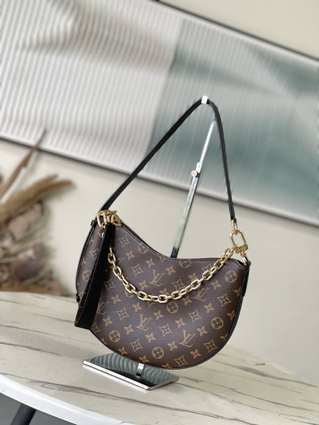 The top-of-the-line original M14056 Cookie Bb handbag is crafted from Monogram c