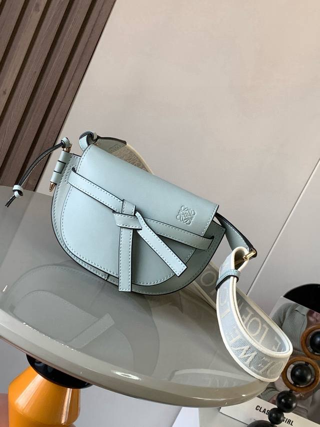The popular mini 21cm saddle bag with a new lettered wide shoulder strap. The wi