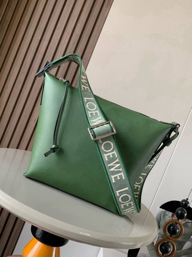The small Cubi crossbody bag makes a stunning appearance. The Cubi is a real sur
