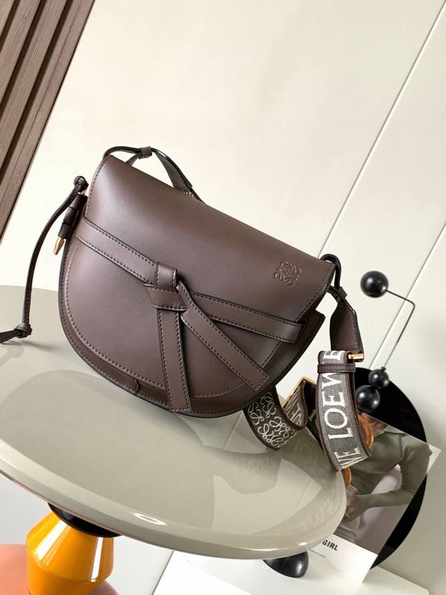 A popular small 25cm saddle bag with a new lettered wide shoulder strap. The wid