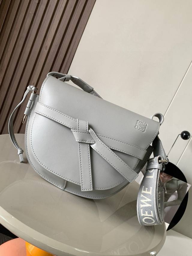 A popular small 25cm saddle bag with a new lettered wide shoulder strap. The wid