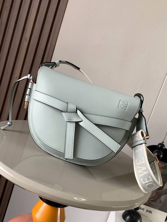 A popular small 25cm saddle bag with a new lettered wide shoulder strap. The wid