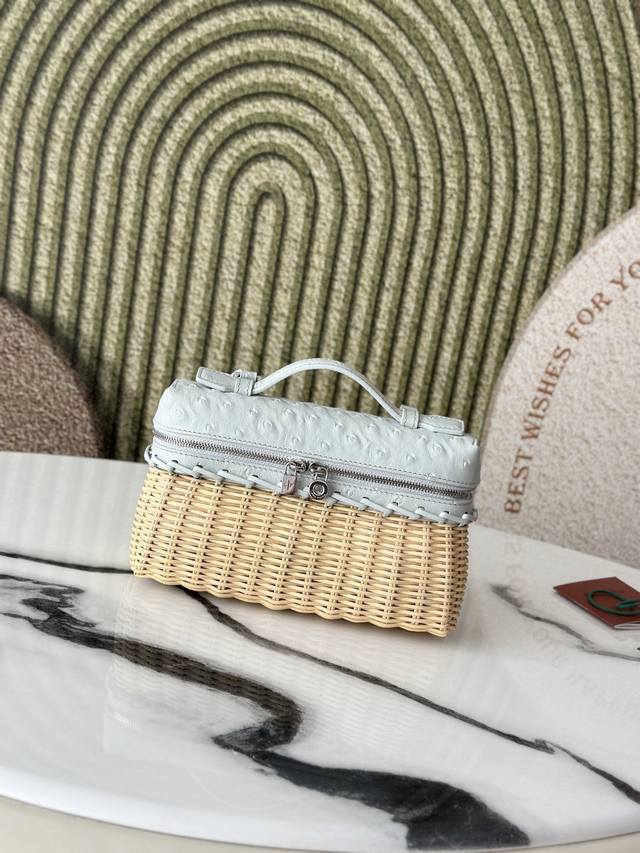 This compact Extrapocket bag combines handwoven bamboo and rattan with the brand