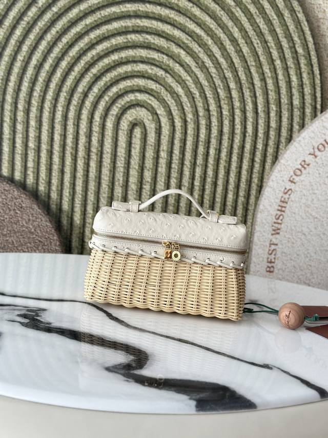 This compact Extrapocket bag combines handwoven bamboo and rattan with the brand